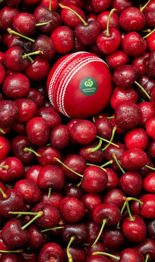 Cricket ball amongst seasonal cherries